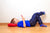 boy lying on floor of bedroom using mobile phone