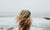 rear view of lady looking at ocean