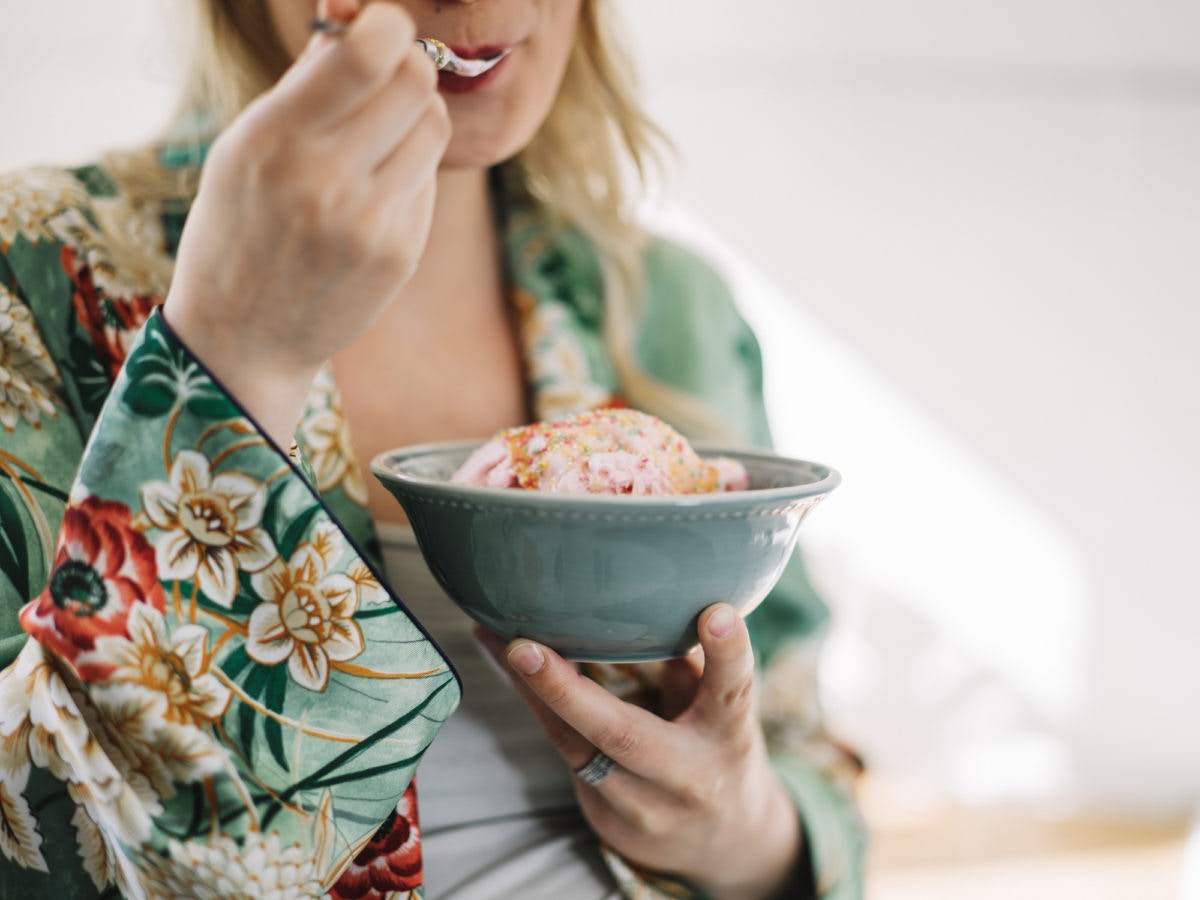 woman eating ice cream in bowl