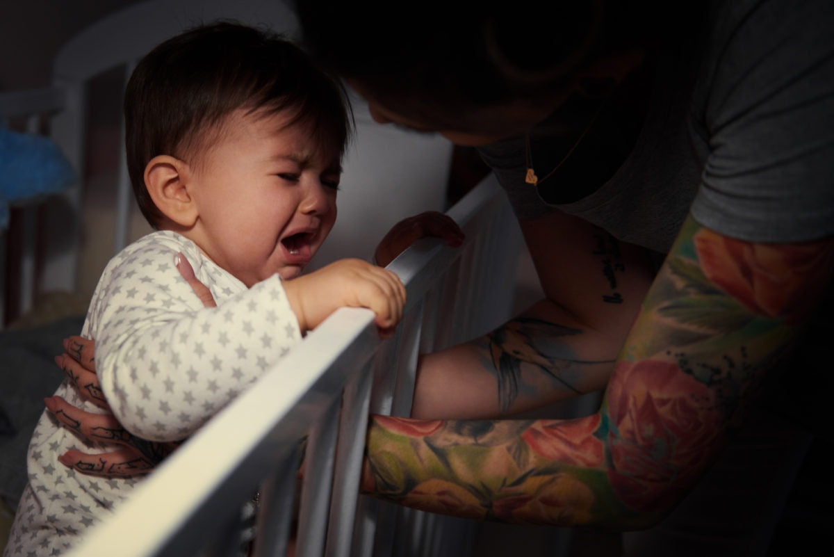 crying baby in crib