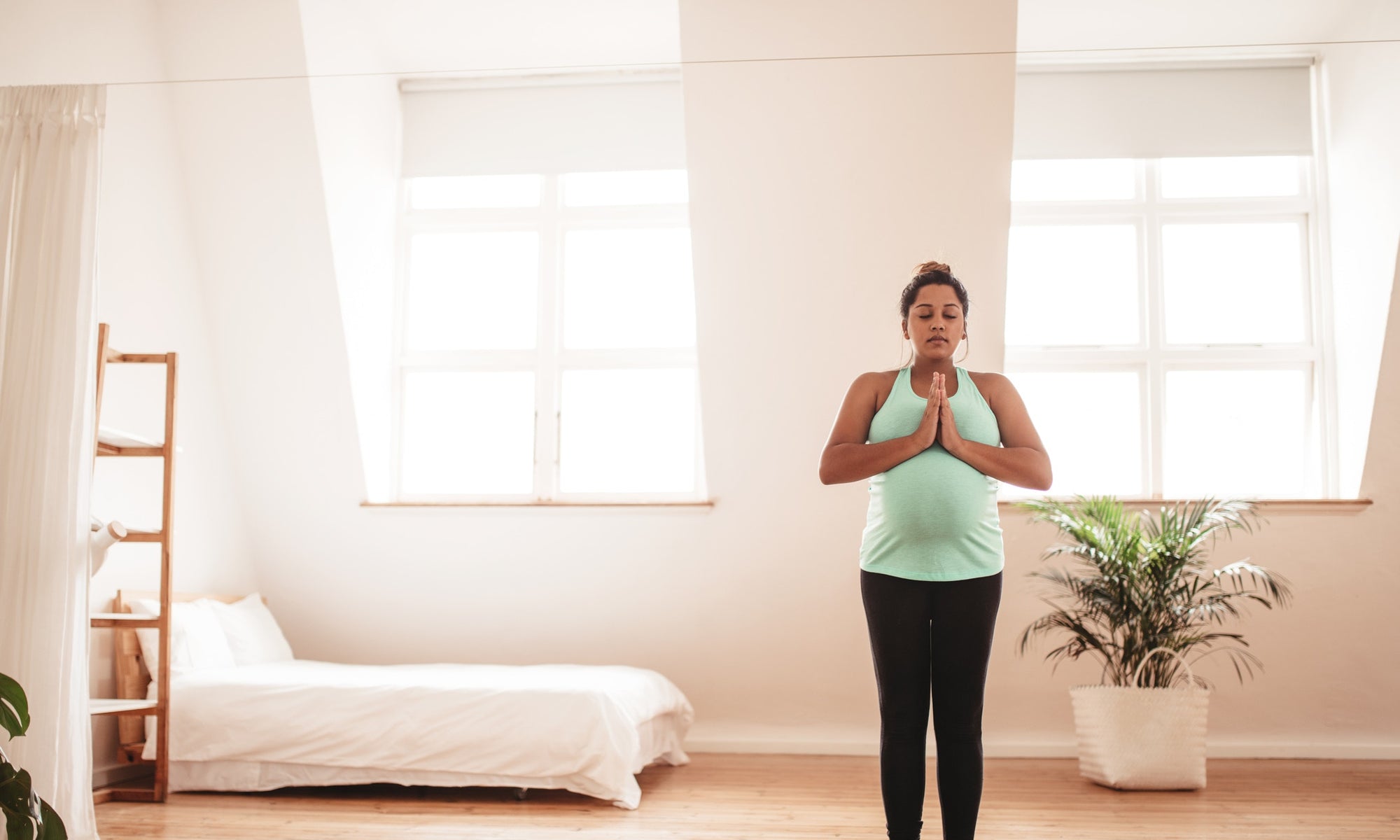 a pregnant lady doing yoga