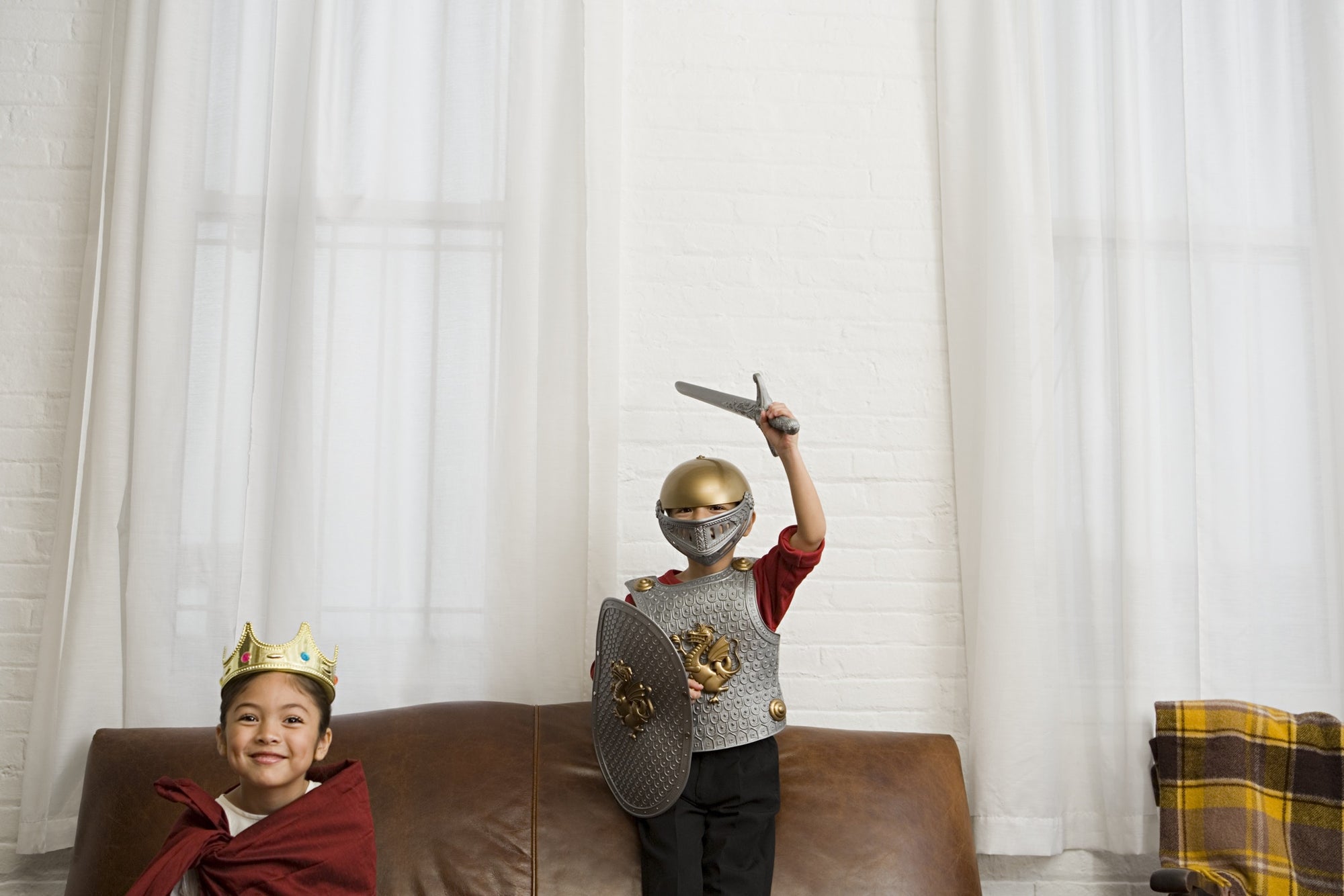 Boys in knight costume in living room