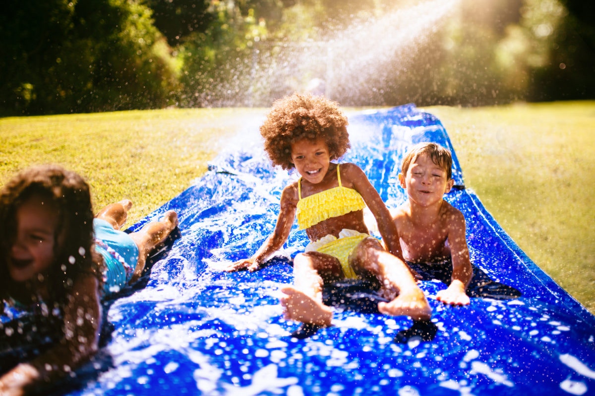 kids pplaying in Homemade Water Slide