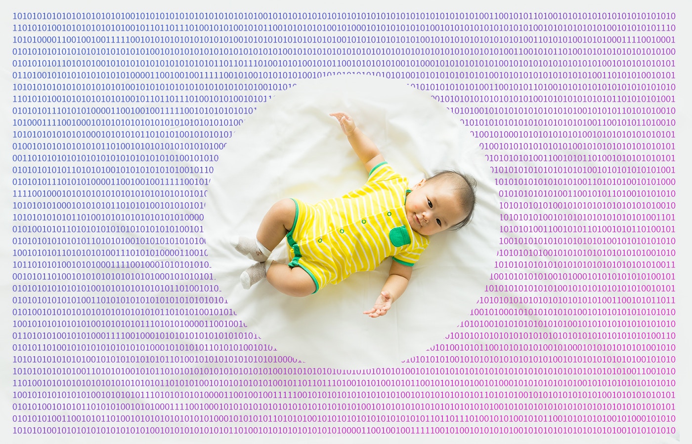 toddler in a bed sheet printed with binary digits 