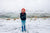 winter portrait of a young boy with red beanie and sweater 