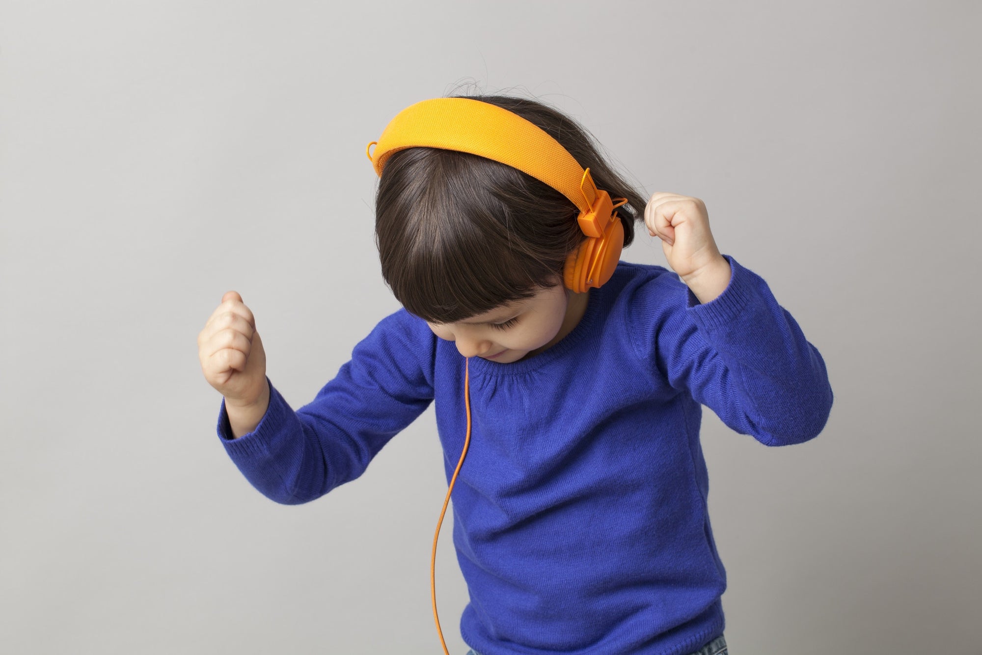 young boy listen music with headphone