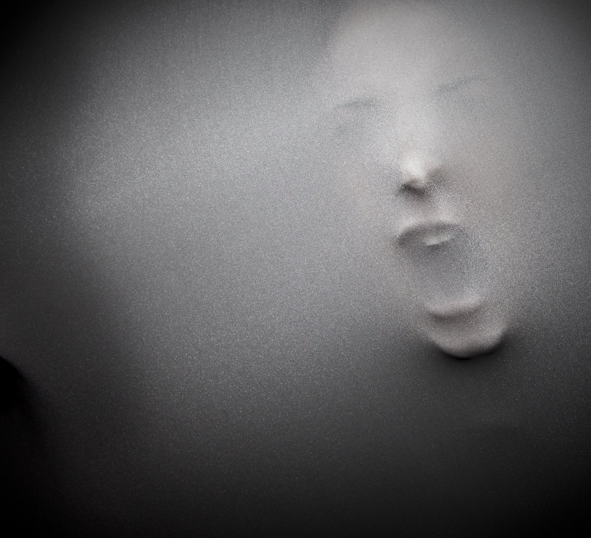 Face appearing from wall