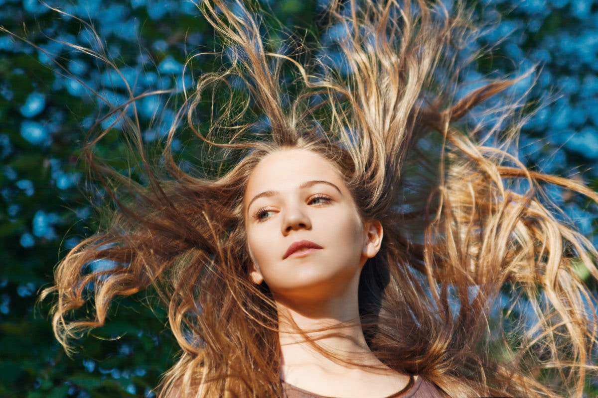 young girl with flying hair