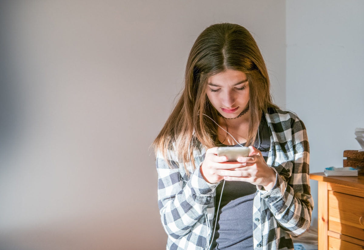 teenage girl using mobile phone