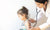 Pediatrician diagnising a child