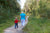 Back view of Grandmother and granddaughter are walking outdoors