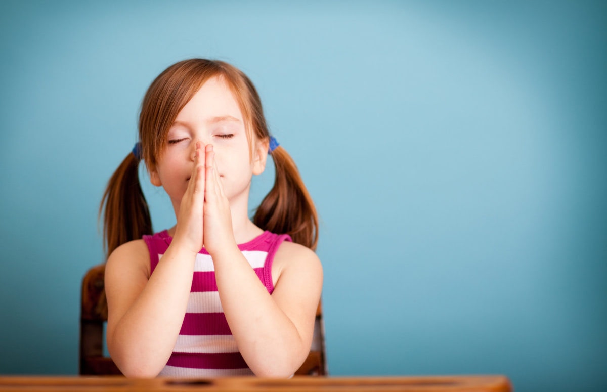Child doing prayer