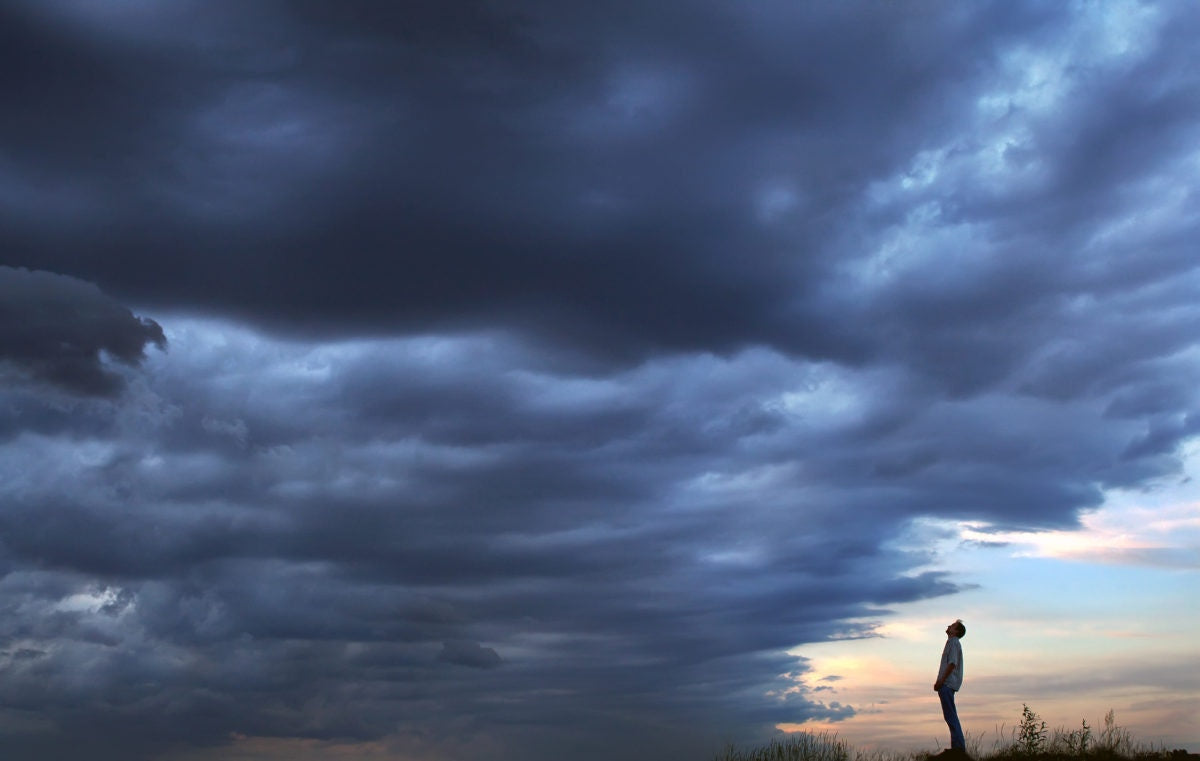 A man looking at clouds