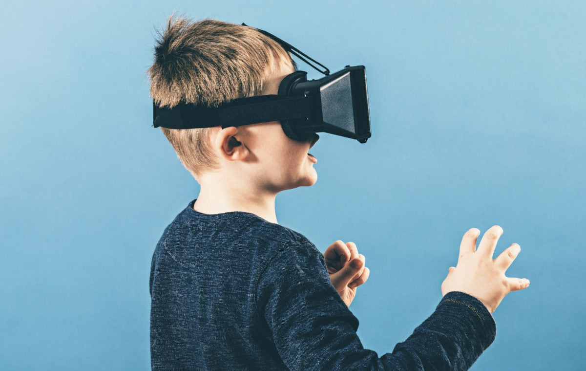 Young boy with VR goggles