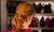 Rear view of confused young woman looking at shoes displayed on shelves