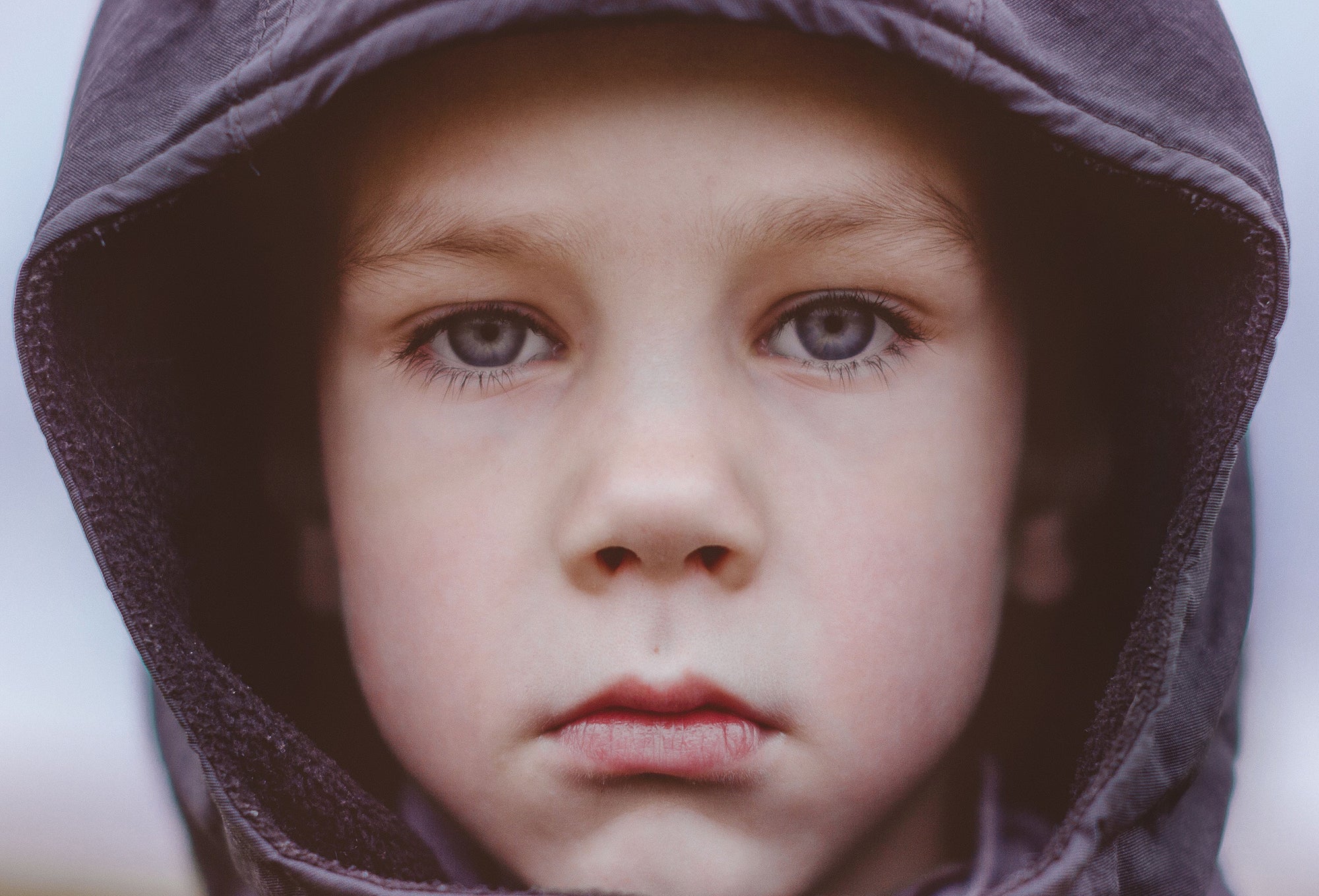 boy with grey eyes looking at camera