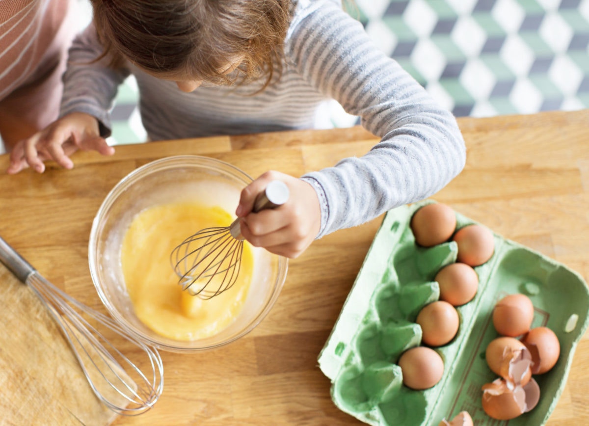 girl making eggs
