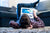 boy on ground looking at a tablet