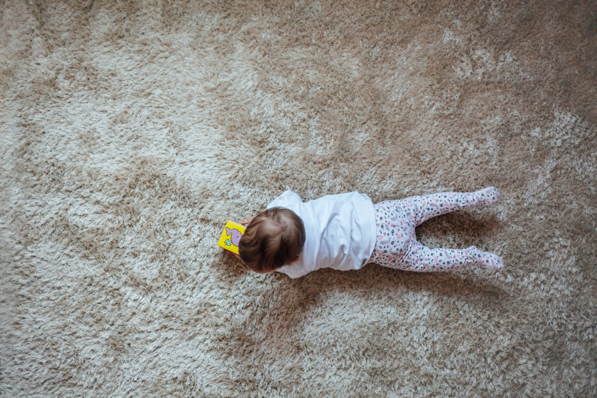 Baby playing on floor
