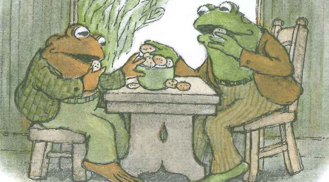 Two funny frog eating with well dressed