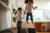 Children jumping on a sofa