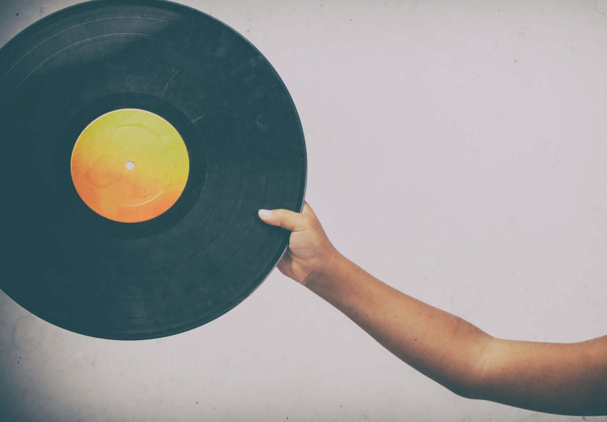 Hand holding vinyl record