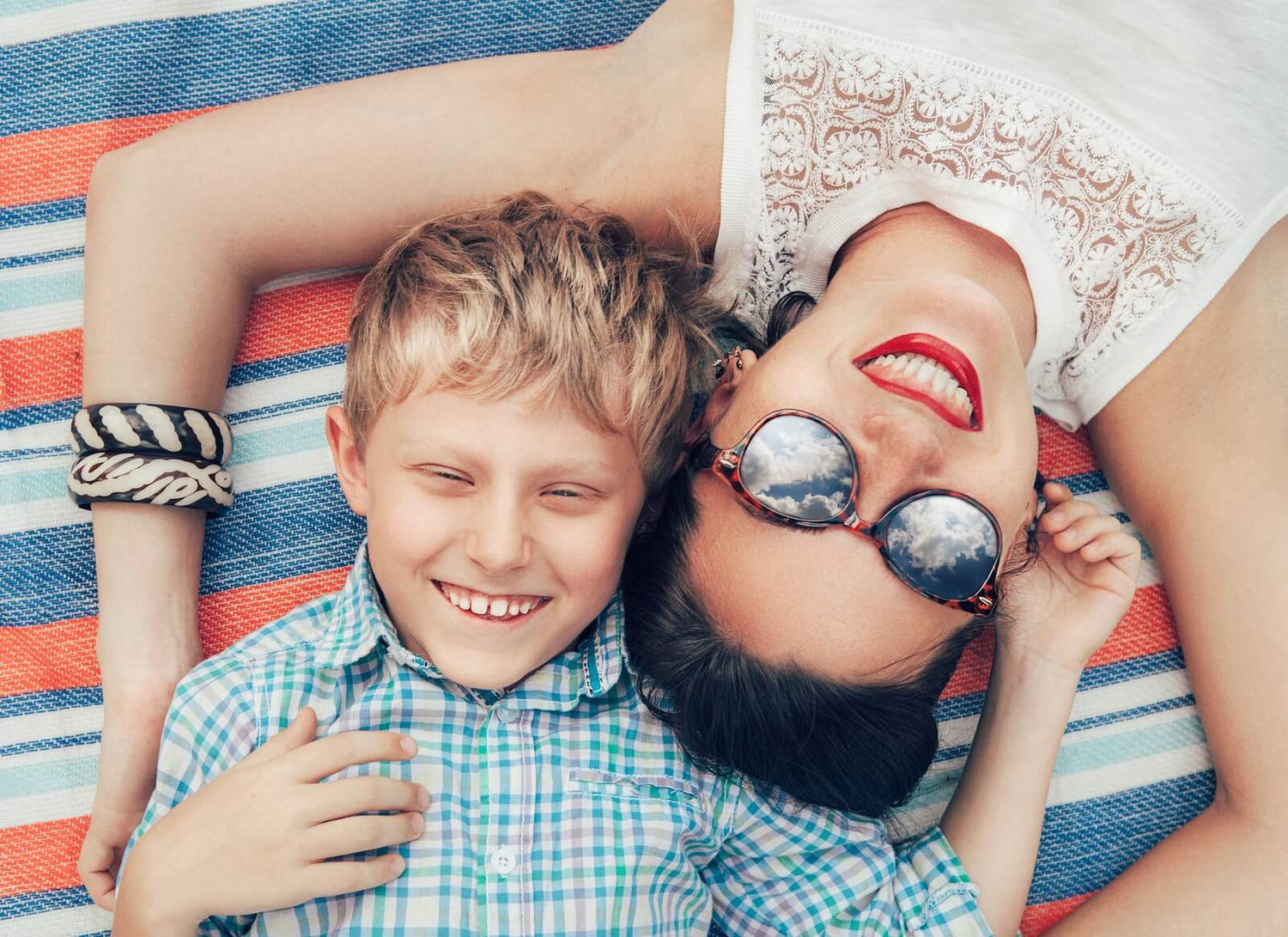 Top view, happy mom and son are smiling
