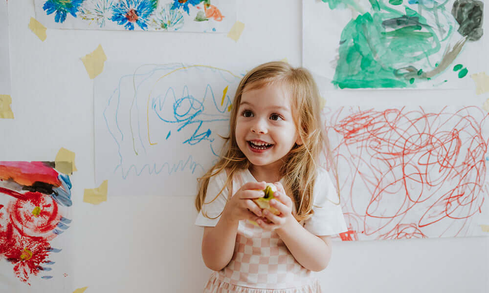 girl holding an apple