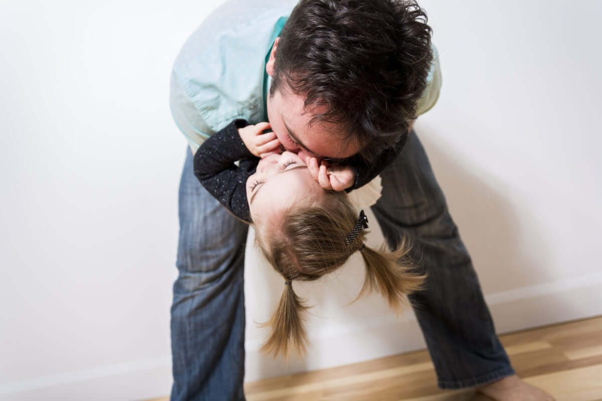 Father holding her child