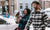 couple and mother carrying her baby in carrier in snow