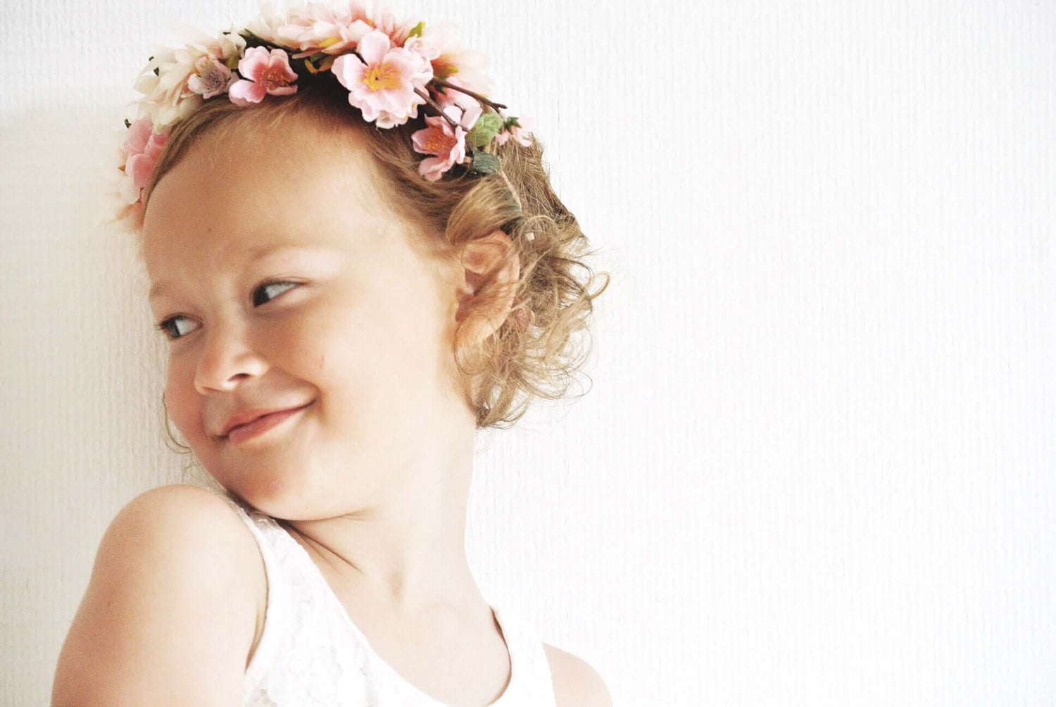 girl in white dress with flower crown