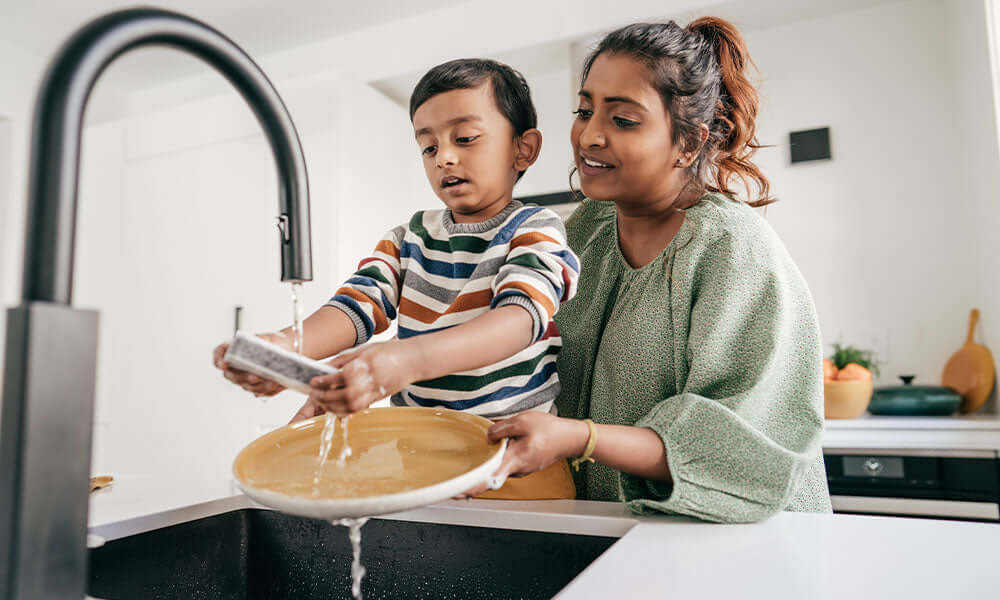 boy cleaning dishes