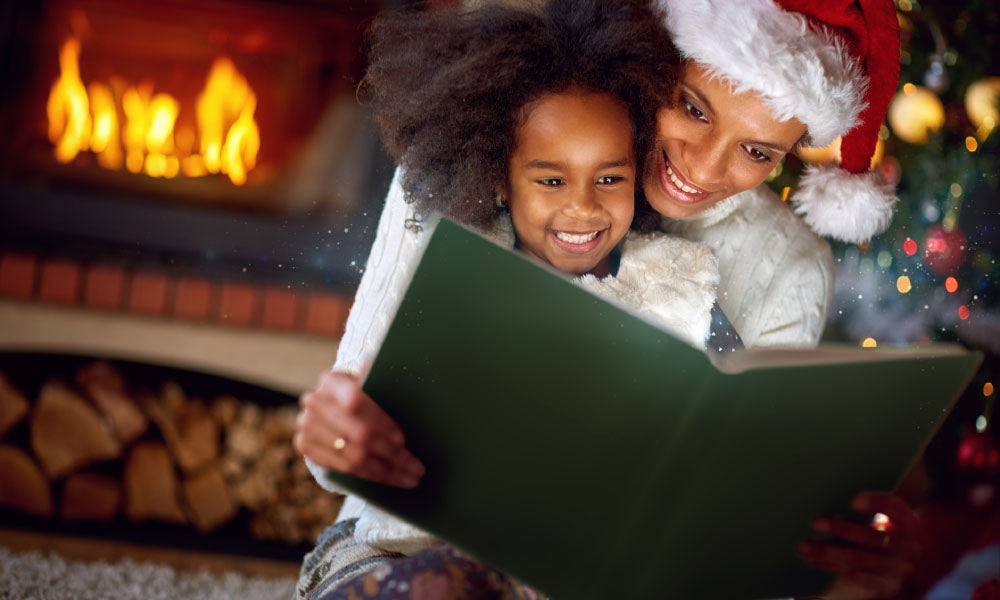 ittle girl reading fairytales with mom