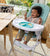 boy eating in high chair