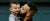 man carrying baby boy and kissing on cheek photo