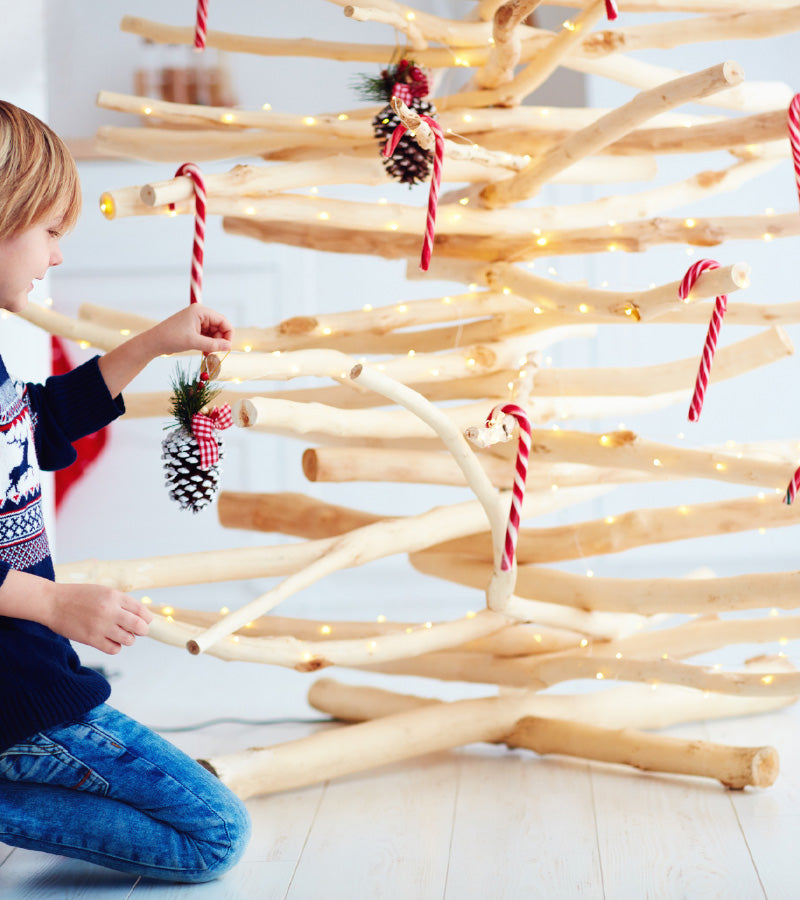 kid decorate handcrafted christmas tree
