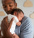 young father holding baby